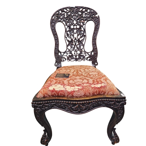 119 - Hall chair with ornately carved back. Has had some restoration