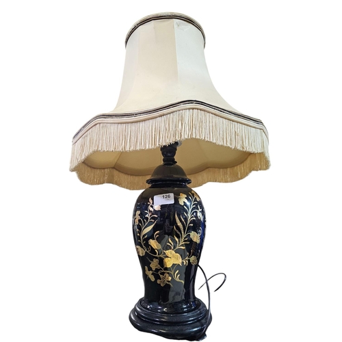 126 - Gloss black ceramic lamp base with golden flower decoration, complete with shade