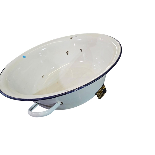 128 - Large oversized enamel basin with handles. Approx 64cm across.