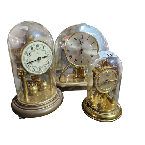 142 - Collection of 3 glass domed mantle clocks