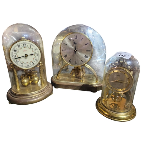 142 - Collection of 3 glass domed mantle clocks