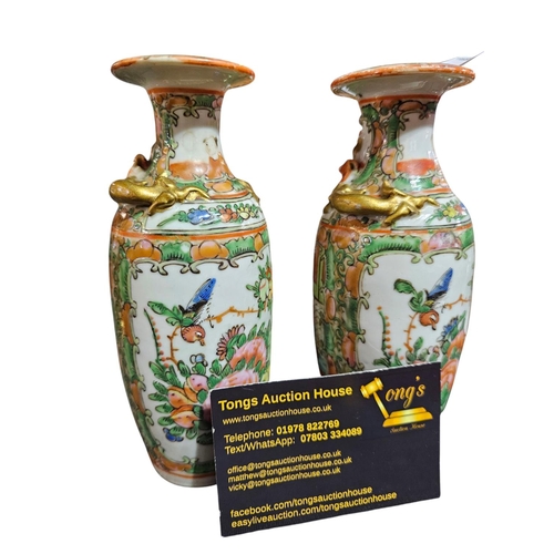 145 - Pair of Chinese handpainted vases, standing approx 16cm tall