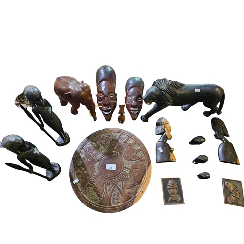 29 - Very large collection of hand carved African items to include Tribesmen, elephants and masks