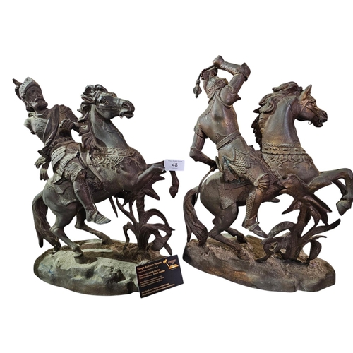 48 - A pair of spelter figures depicting soldiers on horseback