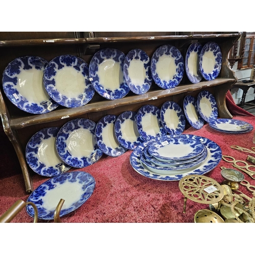 113 - Antique flow plate set with it's signature blurred cobalt blue design. Stamped Regent England