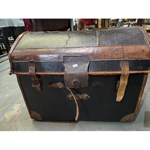 118 - Large curved top travelling trunk with leather straps