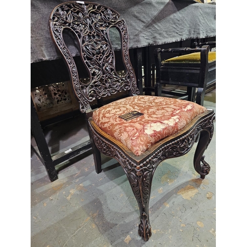 119 - Hall chair with ornately carved back. Has had some restoration