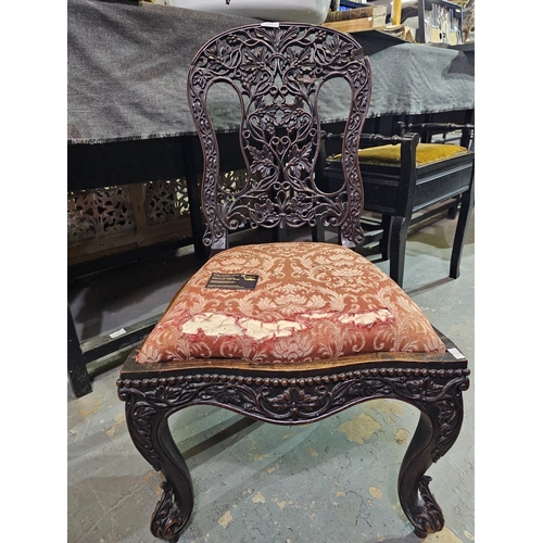 119 - Hall chair with ornately carved back. Has had some restoration