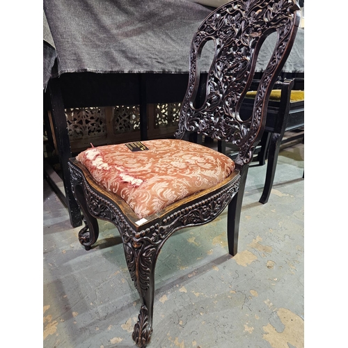 119 - Hall chair with ornately carved back. Has had some restoration