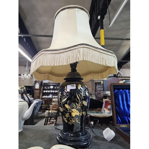 126 - Gloss black ceramic lamp base with golden flower decoration, complete with shade