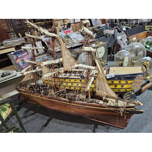 139 - Pair of intricate wooden boat replica models. The sailboat is approx 29