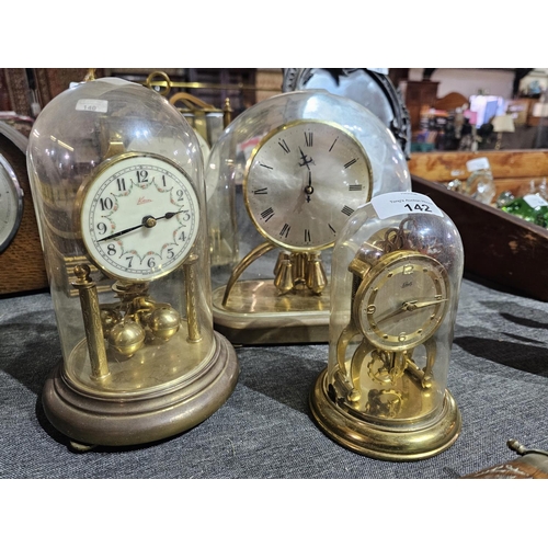 142 - Collection of 3 glass domed mantle clocks