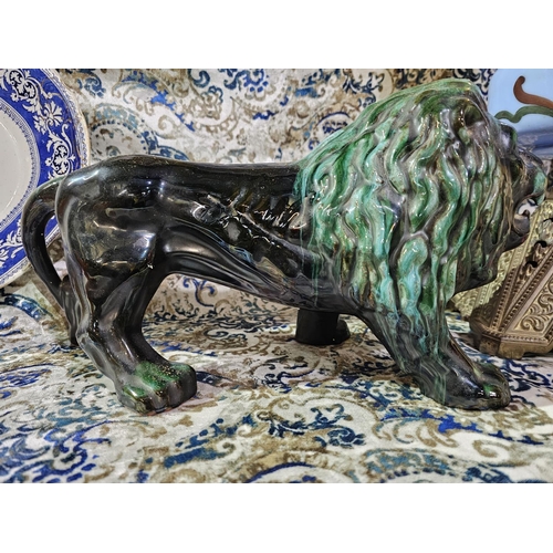 47 - A vintage Blue Mountain Pottery lion figurine, likely made in Canada