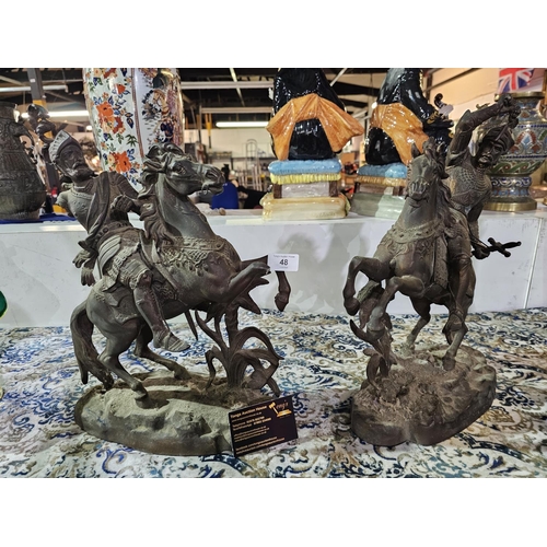 48 - A pair of spelter figures depicting soldiers on horseback