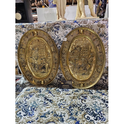 55 - Pair of vintage hammered brass decorative wall plates, depicting tavern life