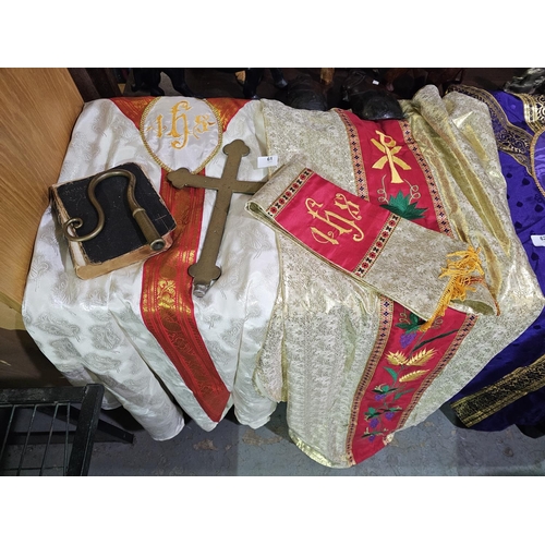 61 - Genuine Anglican priest cassocks, large brass cross and bible