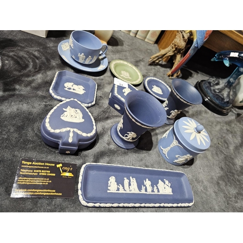 84 - Very large collection of blue and white Jasperware from Wedgwood together with a green and white dis... 