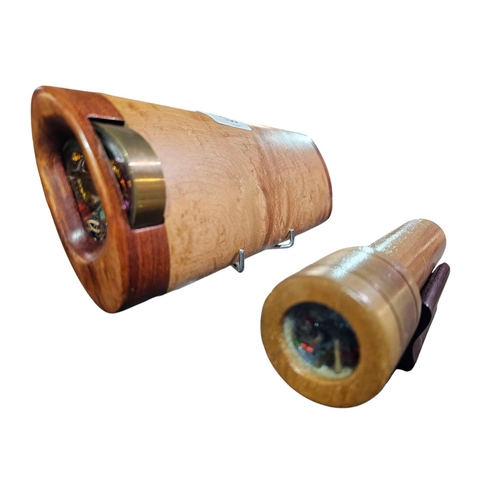 168 - Wooden oval shaped kaleidoscope on stand together with a smaller round kaleidoscope on plinth