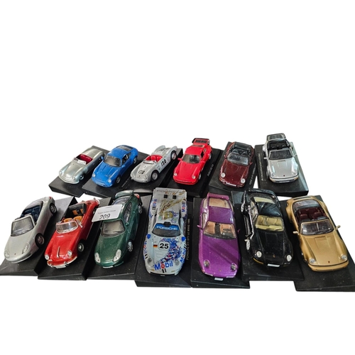 209 - Collection of mounted model Porsche cars