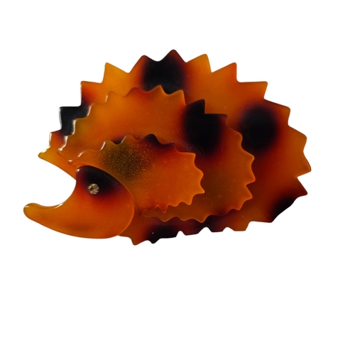 12 - Hedgehog perspex brooch is in the style of Tatty Devine.