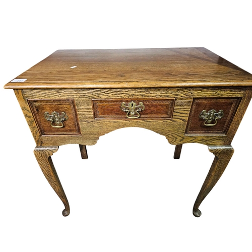 281 - George the III style oak  three drawer lowboy with shaped apron 75cm x 45cm x 74cm high