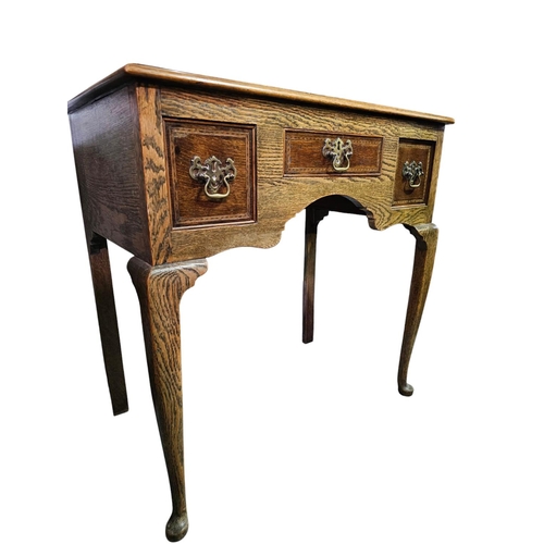 281 - George the III style oak  three drawer lowboy with shaped apron 75cm x 45cm x 74cm high