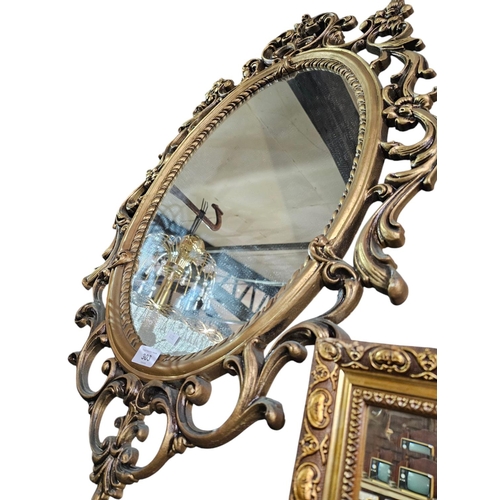 303 - Plaster and gilt framed large oval mirror