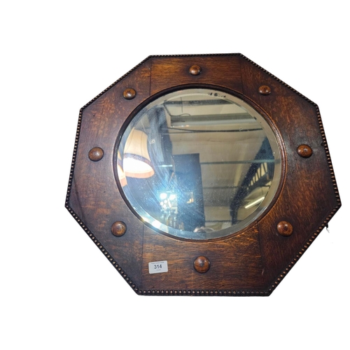 314 - Wooden Octagonal Arts and crafts heavily framed wall mirror