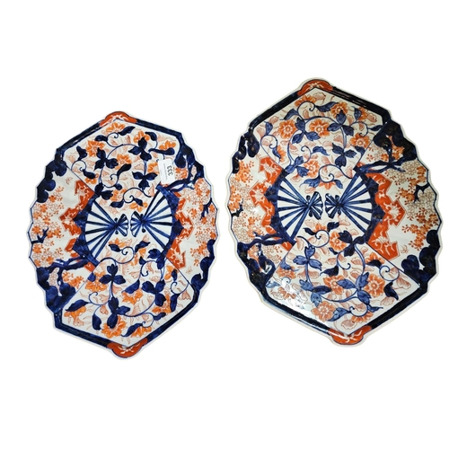 333 - Pair of Japanese Imari scalloped edge chargers, painted with iris against brocade fan panels. 40cm d... 