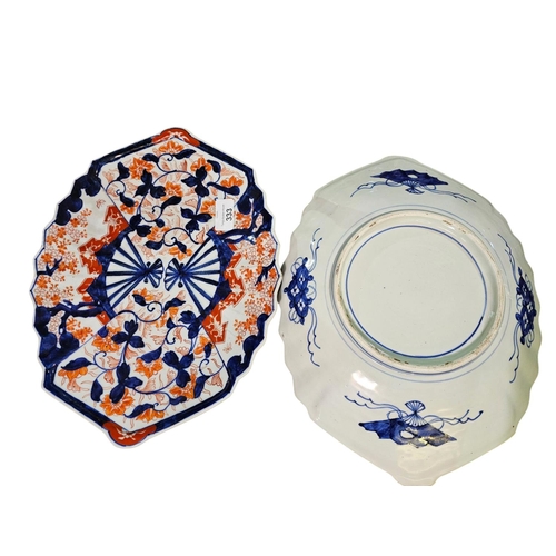 333 - Pair of Japanese Imari scalloped edge chargers, painted with iris against brocade fan panels. 40cm d... 