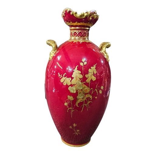 345 - A Royal Crown Derby ovoid twin handled vase with floral gilt tooled decoration against a claret grou... 