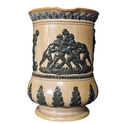 361 - A Royal Doulton stoneware jug, sprig decorated with rugby players, 14cm