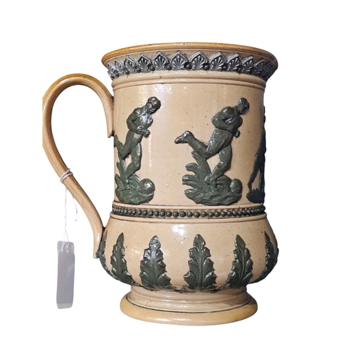 361 - A Royal Doulton stoneware jug, sprig decorated with rugby players, 14cm