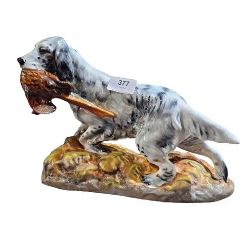 377 - A Royal Doulton model of a setter retrieving a pheasant HN2529