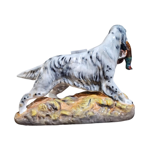 377 - A Royal Doulton model of a setter retrieving a pheasant HN2529