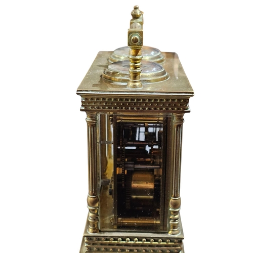 405 - An early 20th century timepiece and barometer within a carriage clock type case with double handle a... 