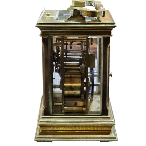 406 - A stunning early 20th century lacquered brass repeating carriage clock, the typical case with fluted... 