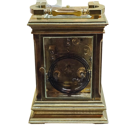 406 - A stunning early 20th century lacquered brass repeating carriage clock, the typical case with fluted... 