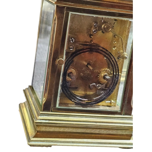 406 - A stunning early 20th century lacquered brass repeating carriage clock, the typical case with fluted... 