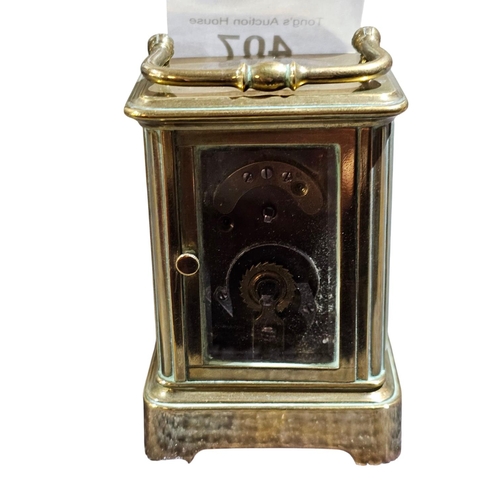 407 - A miniature carriage timepiece, the lacquered brass corniche case with white enamelled Roman dials w... 