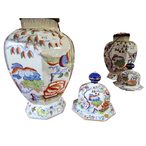 415 - A pair of Mason's ironstone, China vases and covers of bulbous, octagonal form fitted as electric ta... 