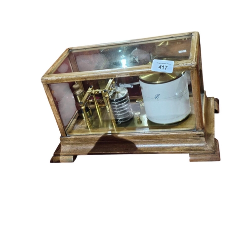 417 - A late 19th/early 20th century brass lacquered and oak cased barograph', with 8 tier bellows, contai... 