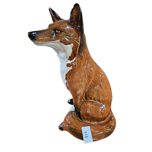 418 - A Beswick model of a seated fox impressed model number 234831 cm high.