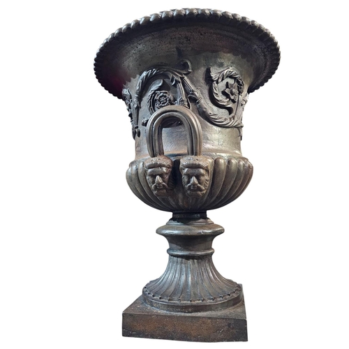 429 - A pair of Victorian cast iron twin handled Campana garden urns with lobbed rim and lower body with s... 