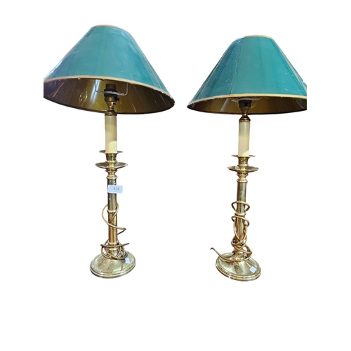 436 - Pair of brass candle stick lamps with green shades