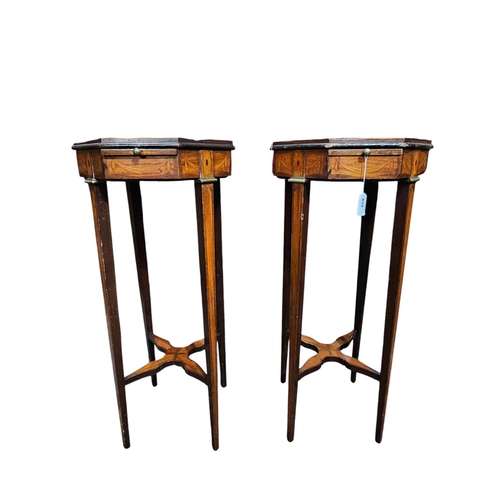 440 - A pair of 19th century kettle stands veneered throughout in mahogany and satinwood. The octagonal to... 