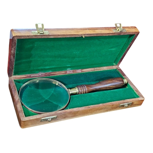 450 - 20th century box housing a magnifying glass