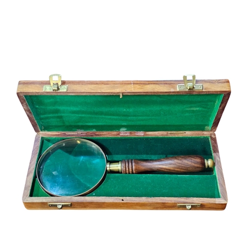 450 - 20th century box housing a magnifying glass