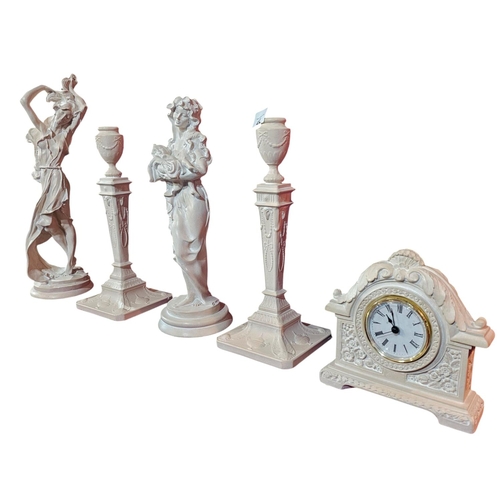 452 - Hand cast figurines 2 candle stick holders and quartz clock