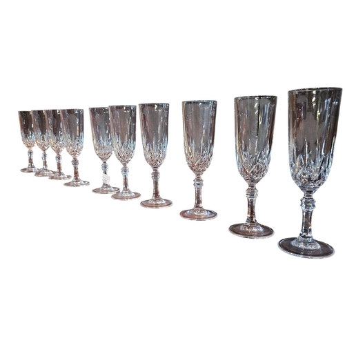 455 - A collection of 10 cut crystal champagne flutes